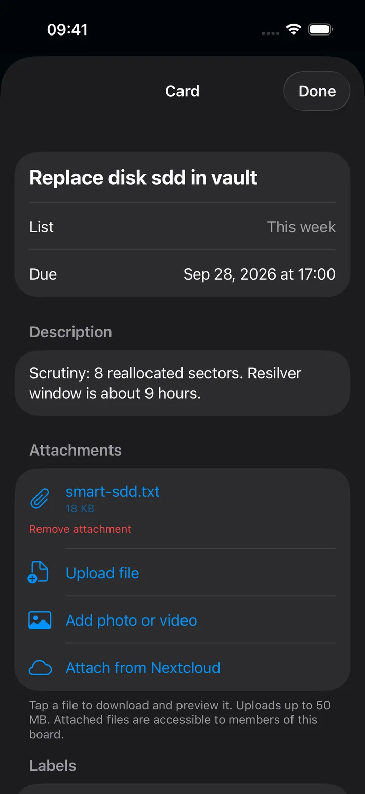 A card detail screen with description, labels, assignees and comments
