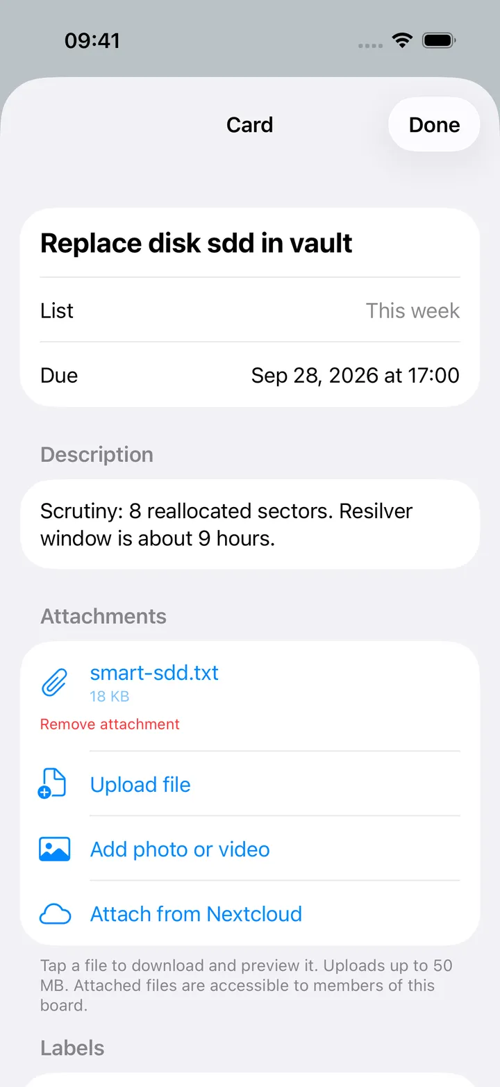 A card detail screen with description, labels, assignees and comments